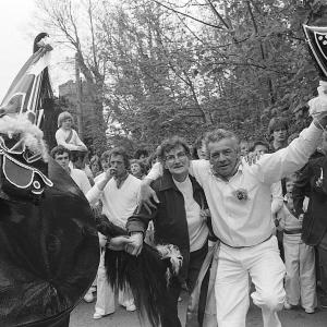 Man and woman with Old Oss and churchin background