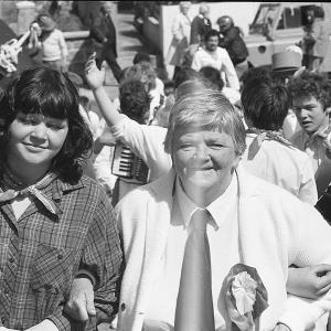 Women smiling, Old Oss in background