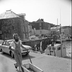 Taffy Thomas pushing cart on harbourside