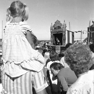 People watching Punch and Judy show