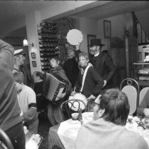 Musicians and children while people eating