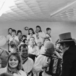 master of ceremonies w accordion players indoors