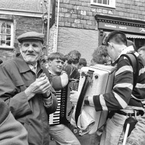People playing music in procession in street