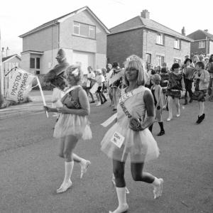 carnival queens walking in road