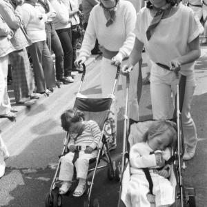 women pushing prams