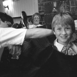 Boy putting on Old Oss costume