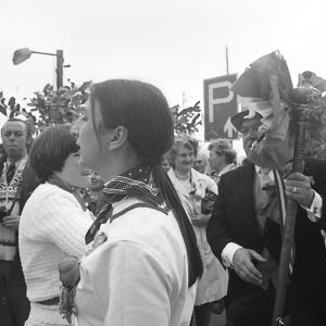 blue ribbon master of ceremonies in crowd