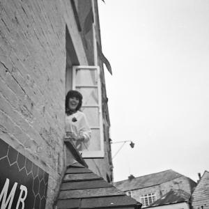 woman watching from window