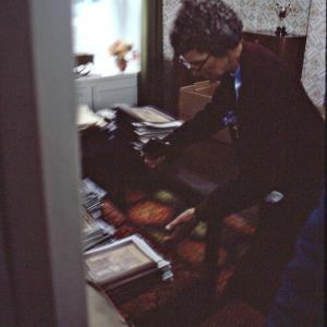 Someone with stacks of documents