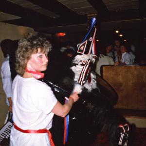 Woman from Old Oss teasing Blue Ribbon Oss