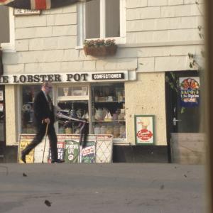 Early morning, man walking past The Strand