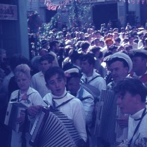 Blue ribbon procession at 10 O'Clock with accordion players in foreground