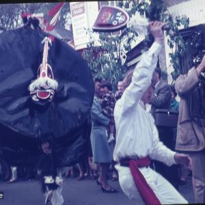Old Oss dancing with teaser, man with film camera