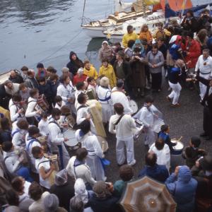 Blue Ribbon Oss dancing beside the harbour