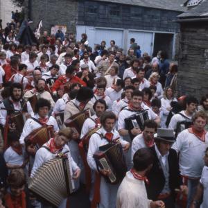 Old Oss band, with Master of Ceremonies, walking down road