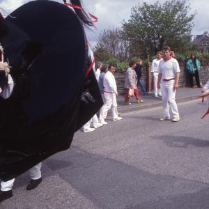 Woman teasing Old Oss in road