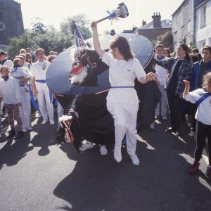 Woman teasing Blue Ribbon in sun 