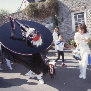 Woman teasing Blue Ribbon in road