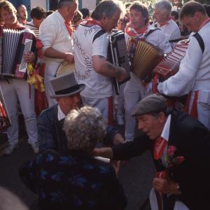 Old Oss Master of Ceremonies knelt down amongst crowd