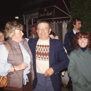 Crowd walking at night, people smiling