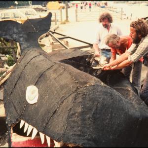 Men deconstructing carnival whale