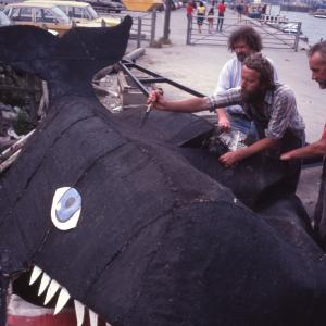Men deconstructing carnival whale