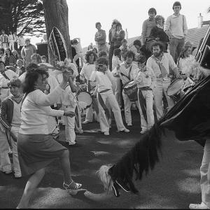 Old Oss with woman teasing  with kids around