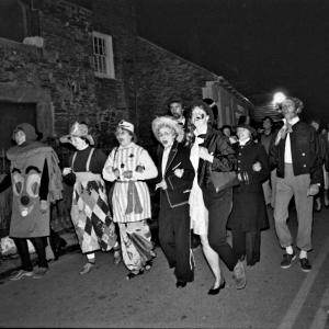 Merrymakers on street at night outside Abbey House