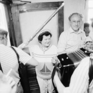 landlady of pub w accordion player