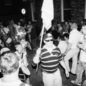 people dancing w flag