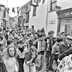 People in procession in street