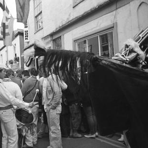 Old Oss in street with band