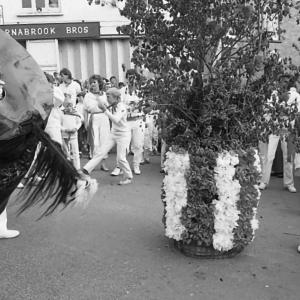 boys dancing under maypole