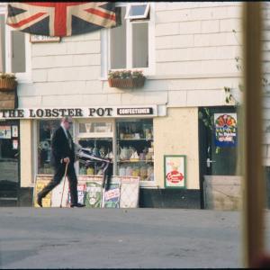 Early morning, man walking past The Strand