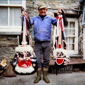 Doc Rowe holding Old Oss and Blue Ribbon Oss hats