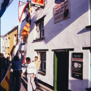 Putting up flags outside Golden Lion