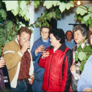 People outside The Harbour Inn at night
