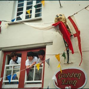 People watching from Golden Lion upstairs window