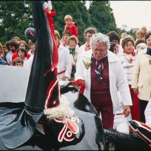 Woman holding club on Old Oss