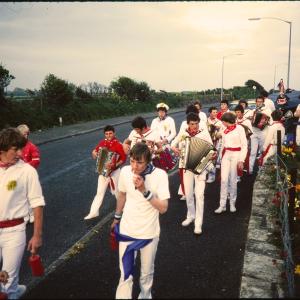 Early morning, Children's Oss band  walking along road
