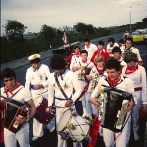 Early morning, Children's Oss band  walking along road