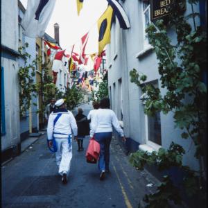 People walking up empty Lanadwell Street
