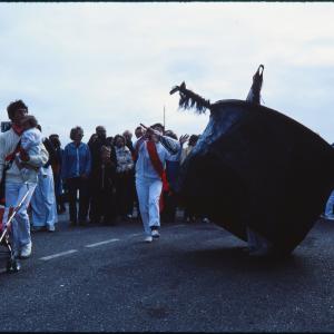 Old Oss being teased, while man with pushchair walks past