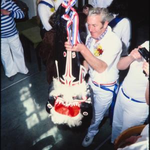 Blue Ribbon hat held up by man
