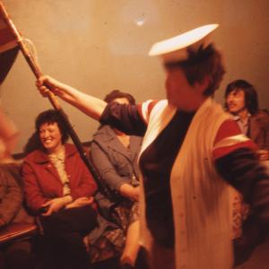 Woman singing, holding union flag