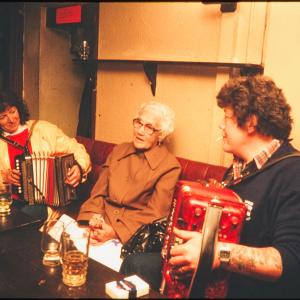 accordion players sat in Harbour Inn