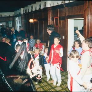 Children circled around Old Oss inside 