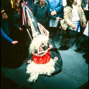 Blue Ribbon with children crowded around