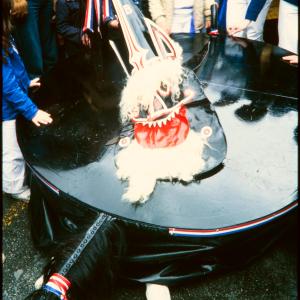 Blue Ribbon with children crowded around 