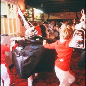 Children dancing with Old Oss in pub